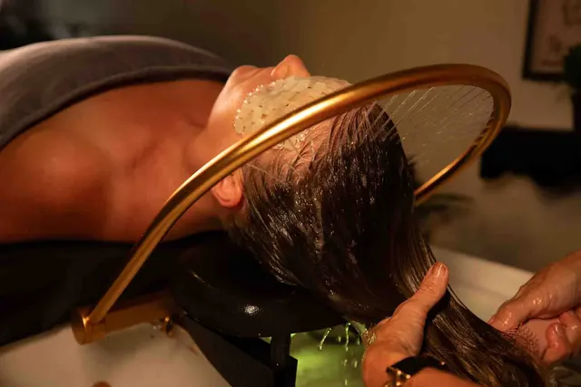 Kelley rinsing a client’s hair during a HeadSpa at Kelley Ann Brackett Salon