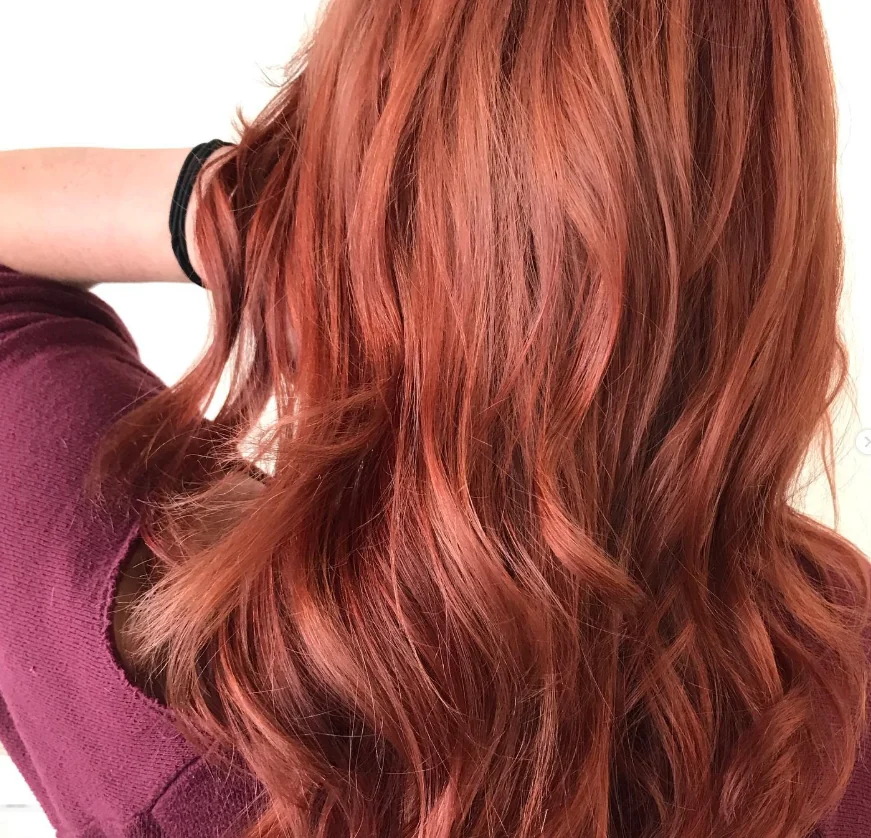 Close-up of auburn waves and hair texture