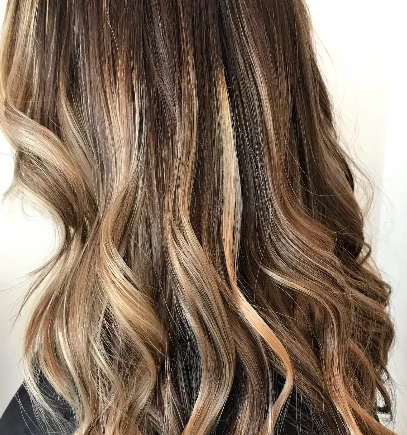 A finished dimensional hairstyle by Kelley, viewed from behind