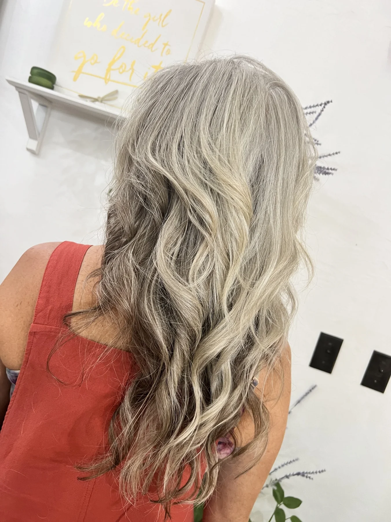 Light-toned hair styled by Kelley, seen from behind